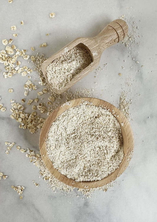 Oat flour in a bowl made from oat milk pulp